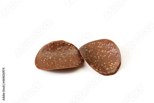 Two thin chocolate covered chips isolated on white background