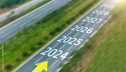 Empty asphalt road with new year numbers 2024, 2025 to 2029