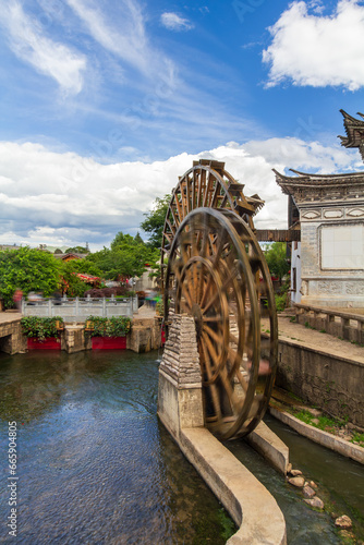 Water wheel is a symbol of Lijiang old town , the World Heritage Site in 1997 ,Yunnan, China.