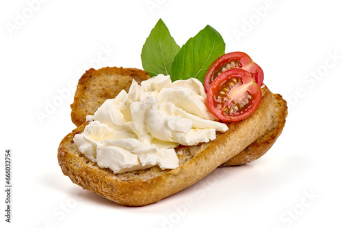 Sandwich with cream cheese and cherry tomatoes, isolated on white background.