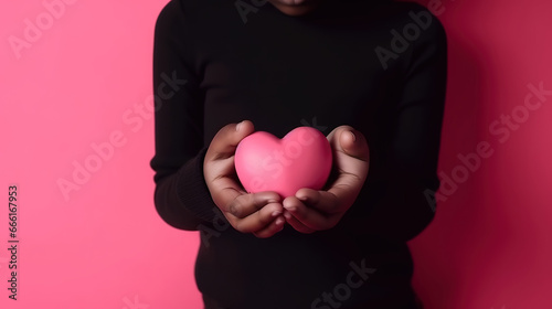 Cute afro boy holding a big heart card with space for text. Generative Ai