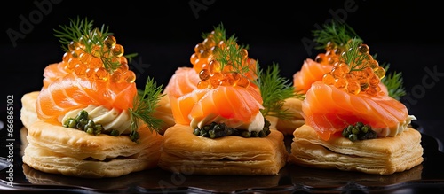 Delicious starters featuring smoked salmon and caviar in puff pastry towers
