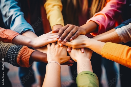 Homosexual diverse group of young people stacking hands. LGBTQ+ support and acceptance. Diverse queer people holding hands.