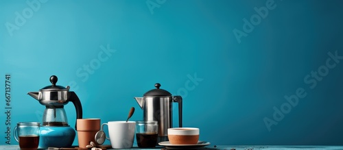Coffee varieties served with milk and tools on a blue table