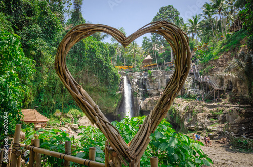 Beautiful Tegenungan waterfall in tropical rainforest in Bali, Indonesia