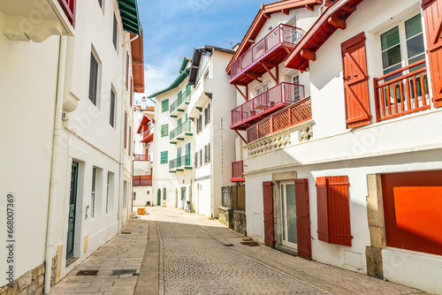 Colored buildings of a narrow street in the city center of Saint-Jean-de-Luz, France 
