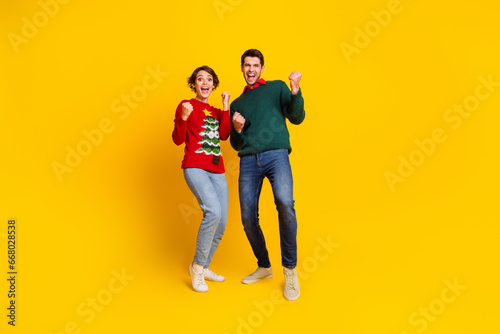 Photo of best fellows lady guy raise fists up enjoy traditional christmas x mas discounts isolated bright color background