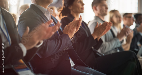 Close Up on Hands of Audience Applauding in Concert Hall During Business Forum Presentation. Technology Summit Auditorium Room With Corporate Delegates. Excited Entrepreneurs Clapping.