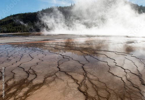 view of the unique pattern of the Grand Prismatic Spring from the wooden path, Midway Geyser Basin, Yellowstone National Park, Wyoming, US