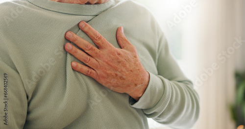 Heart attack, cardiology and person hand on chest with pain, sick and cardiovascular closeup. Indigestion, heartburn and health with wellness, elderly care with medical issue and hypertension