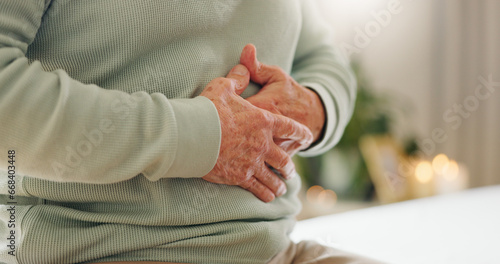 Hands, stomach pain with closeup and gut health, person has digestion issue and nutrition with elderly care. Sick, colon and gas with healthcare and wellness, help and support for stress and illness