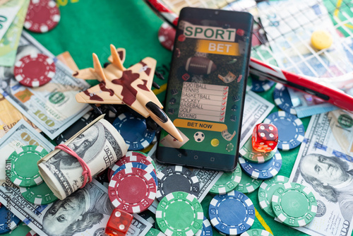 Online poker concept. Smartphone and poker chips on a green background. Poker online banner. Copy space. Vignette. Place for text. Gambling. Background