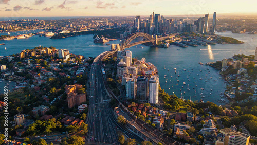 Aerial drone view of Sydney City and Sydney Harbour showing Sydney Harbour Bridge and Lavender Bay in the late afternoon 