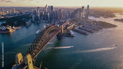 Aerial drone view of Sydney City and Sydney Harbour showing Sydney Harbour Bridge in the late afternoon 