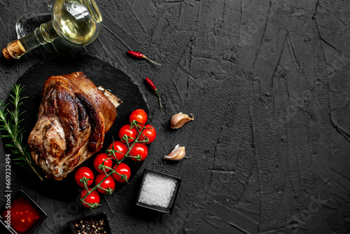 pork knuckle baked in the oven on a stone background with copy space for your text