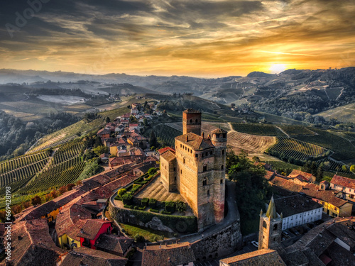 the castle of serralunga d'Alba, in the heart of the Piedmontese Langhe in the autumn period taken from above with a drone at sunset