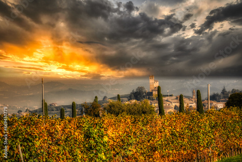 the castle of serralunga d'alba in the midst of the vineyards and hills of the Piedmontese Langhe, in the autumn of 2023 during the truffle and grape harvest festival