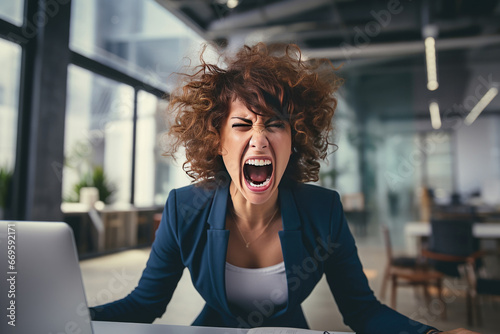 Stressed angry female employee screaming at her workplace