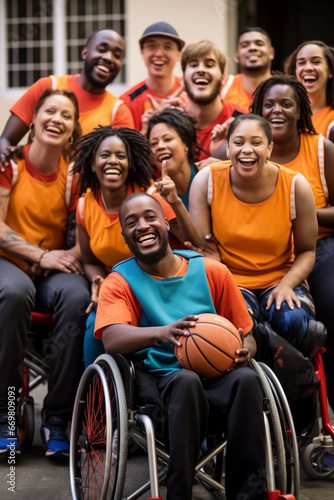 Group photo of a diverse basketball team, including both able-bodied and wheelchair players, all beaming with joy and looking towards the camera.