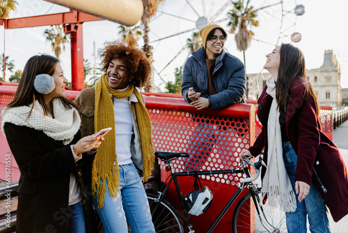 Young group of friends hanging out enjoying city break on winter vacation. Friendship and youth community concept.