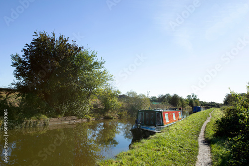 Moored narrow boats on the Trent and Mersey canal in Cheshire UK