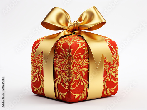 pacchetto regalo di Natale con fiocco oro su sfondo bianco scontornabile visto di tre quarti