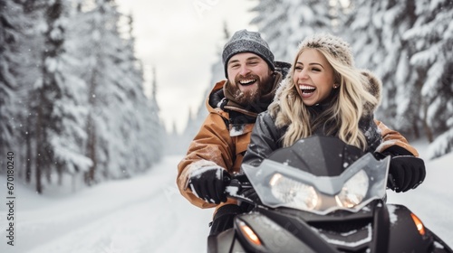 Portrait of happy couple riding on a snowmobile in the snowy forest