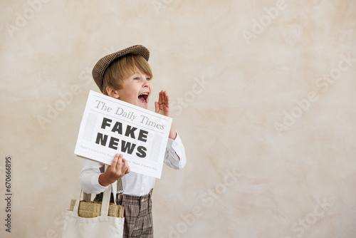 Newsboy shouting against grunge wall background. Boy selling fake news