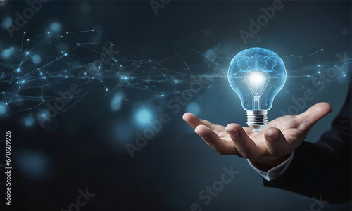 Businessman holding glowing light bulb in hand blue bokeh background. Idea and innovation concept