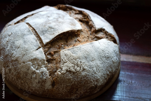 Bread, traditional sourdough bread on a rustic wooden background. Concept of traditional leavened bread baking methods. Healthy food. Copy space