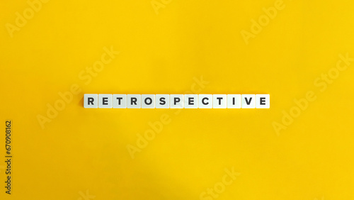 Retrospective Word on Letter Tiles on Bright Orange Background. Minimal Aesthetic.