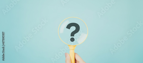 International ask a question day concept, Magnifying glass focused on question mark, Answer, Q&A, Communication and Brainstorming