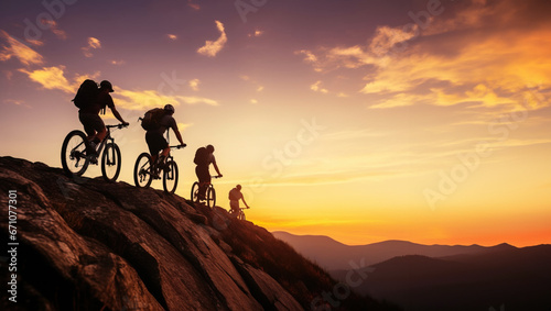 Low angle view of row of cross country bikers traveling in mountain landscape at sunset