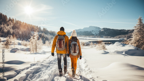 Blissful couple cross-country skiing in a snowy landscape background with empty space for text 