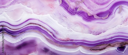 Closeup of polished abstract purple white agate crystal natural quartz healing stone texture background