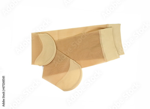 Women's nylon tights body color isolated on white background. Women's nylon stockings beige color. 