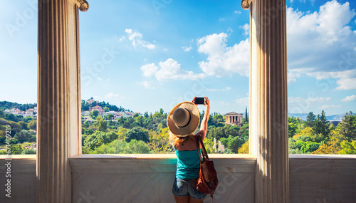 Woman tourist looking at Temple of Hephaestus, Athens in Greece- Ancient Agora