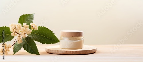 Natural cosmetics concept with cream jar horse chestnut leaf and flowers on wooden stand