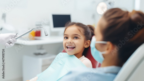 A cute girl smiling in the dentist's office