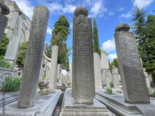 Ottoman Tombstone columns in cemetery of sultans at backyard of Suleymaniye Mosque in Istanbul, Turkey.