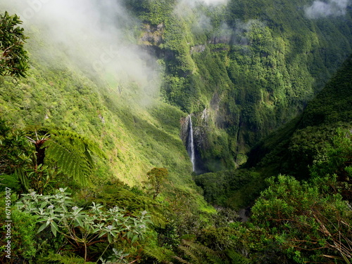 Trou de Fer, a beautifull waterfall in the middle of a primary forest in Reunion island. Tropical rainforest covering mountains cliffs. Scenic landscape in la Réunion