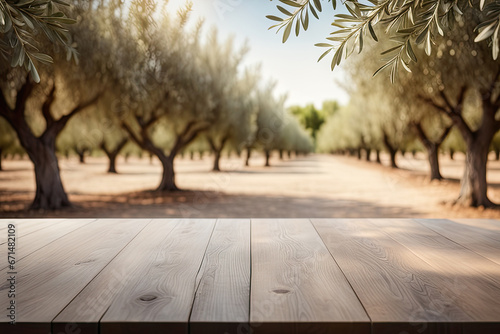 Wooden empty table top, green olive garden trees