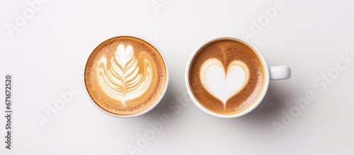 Bird s eye view of latte art in a glass on a white background
