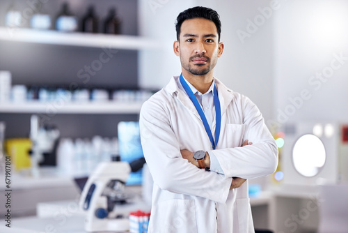 Scientist, man and arms crossed in portrait, science study for medical research in laboratory with confidence. Biotechnology, serious male doctor and scientific experiment, future and investigation