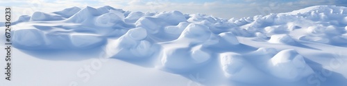 Sweeping snow drifts under blue sky