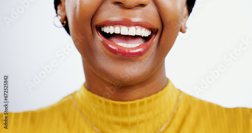 Teeth, smile and closeup of black woman with beauty, lips or happiness in studio white background. Mouth, dental care or African model laugh with skincare, dermatology or wellness from healthcare