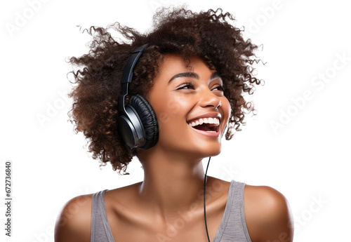 Young African American woman, passionate about music, revelling in the beats and rhythms flowing through her headphones, cut out