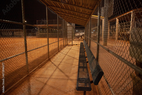 Empty dugout at night, baseball field