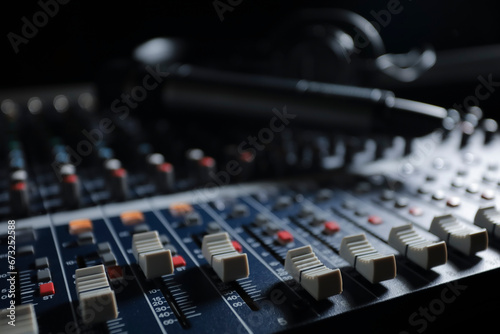Microphone with audio mixer in the control room audio system.