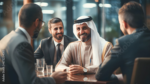 Multi-racial business meeting between a successful Arab investor and business people in an office.